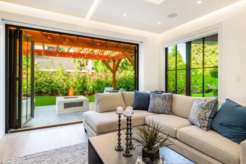 Modern living room opening to garden patio area.