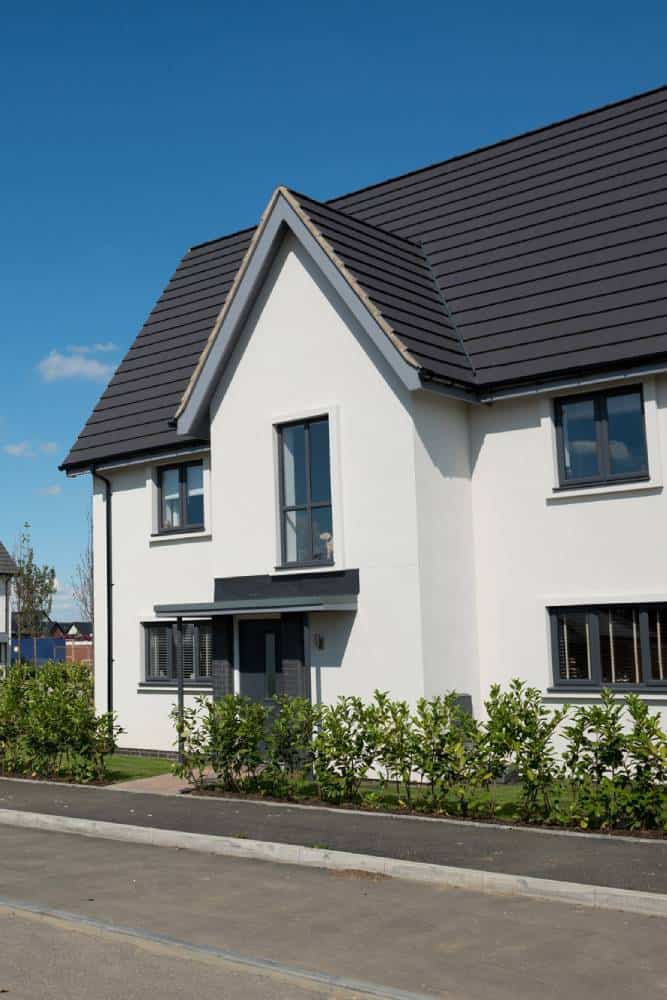 Detached house in UK suburb on sunny day