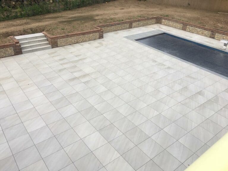 Recently tiled patio area with swimming pool.