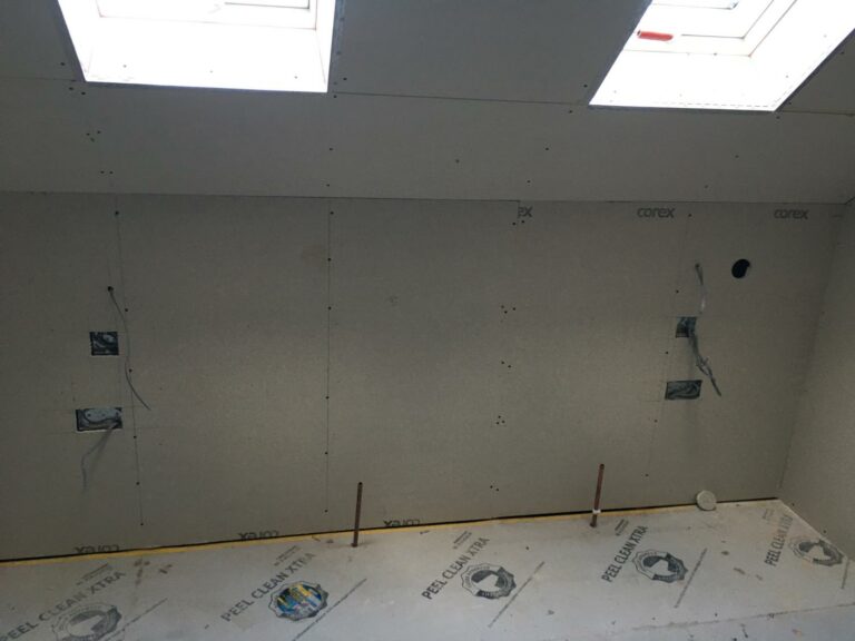 Construction site, unfinished drywall installation, skylight.