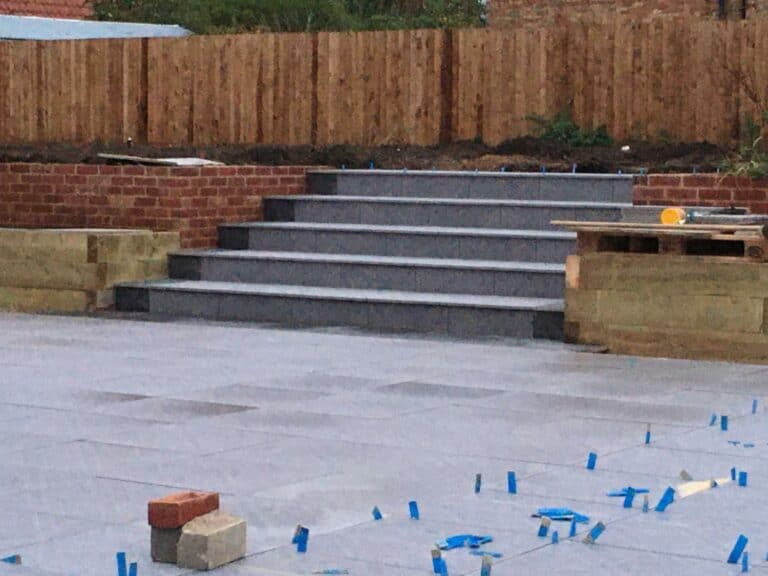 Newly constructed garden steps and patio under twilight.