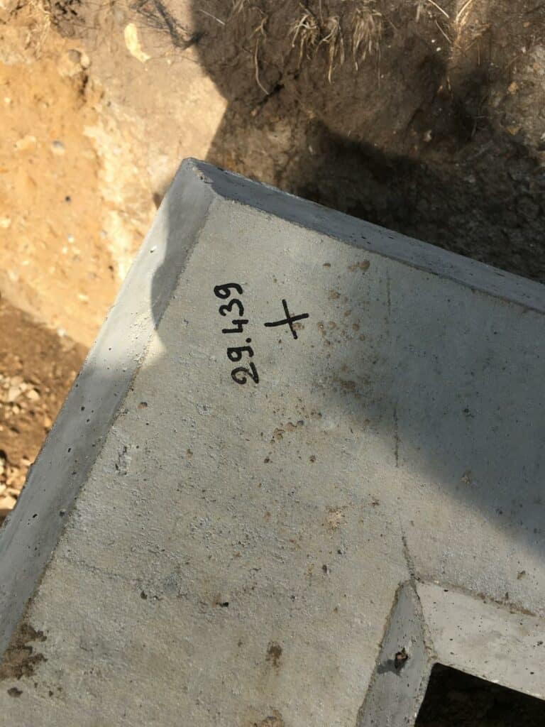 Concrete block with marking in construction site.