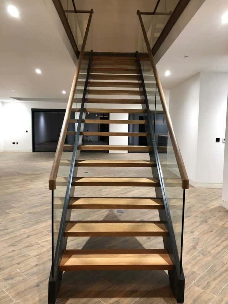 Modern wooden staircase in contemporary interior.