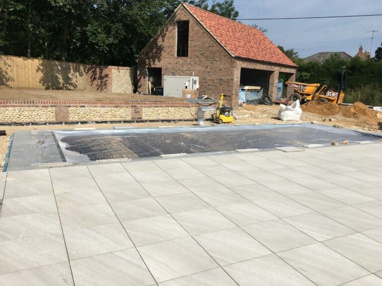 Construction site with paving and machinery.