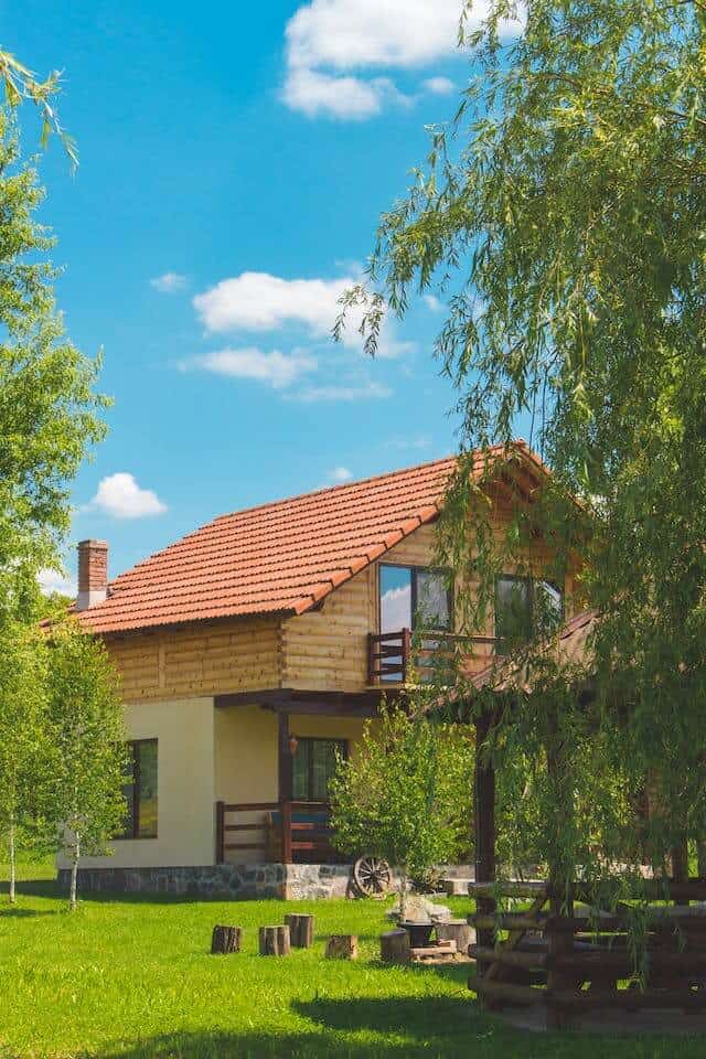 Idyllic country house with garden on sunny day.