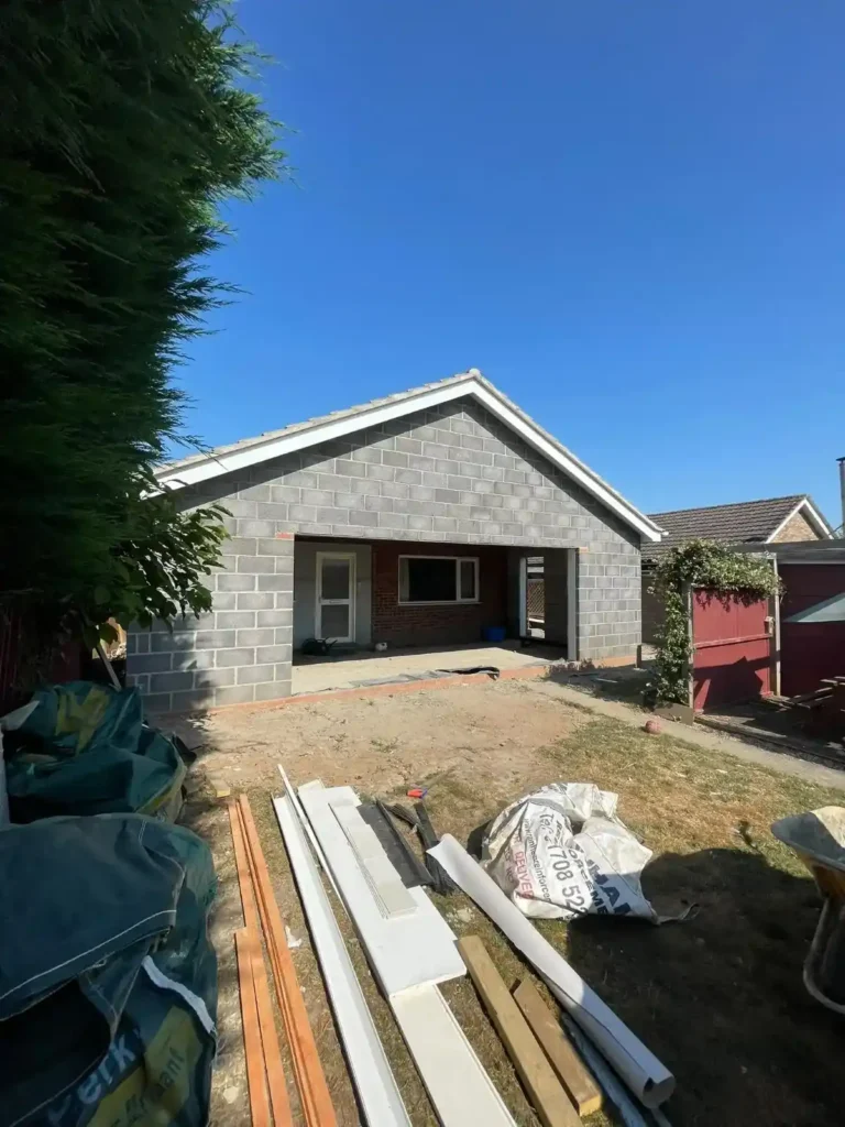 Home Extensions in King’s Lynn showing new blockwork, a pitched roof and a wide garden-facing opening.