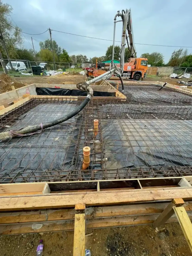 Concrete Services in King's Lynn showing steel reinforcement, timber formwork and pipework prepared for a concrete pour.